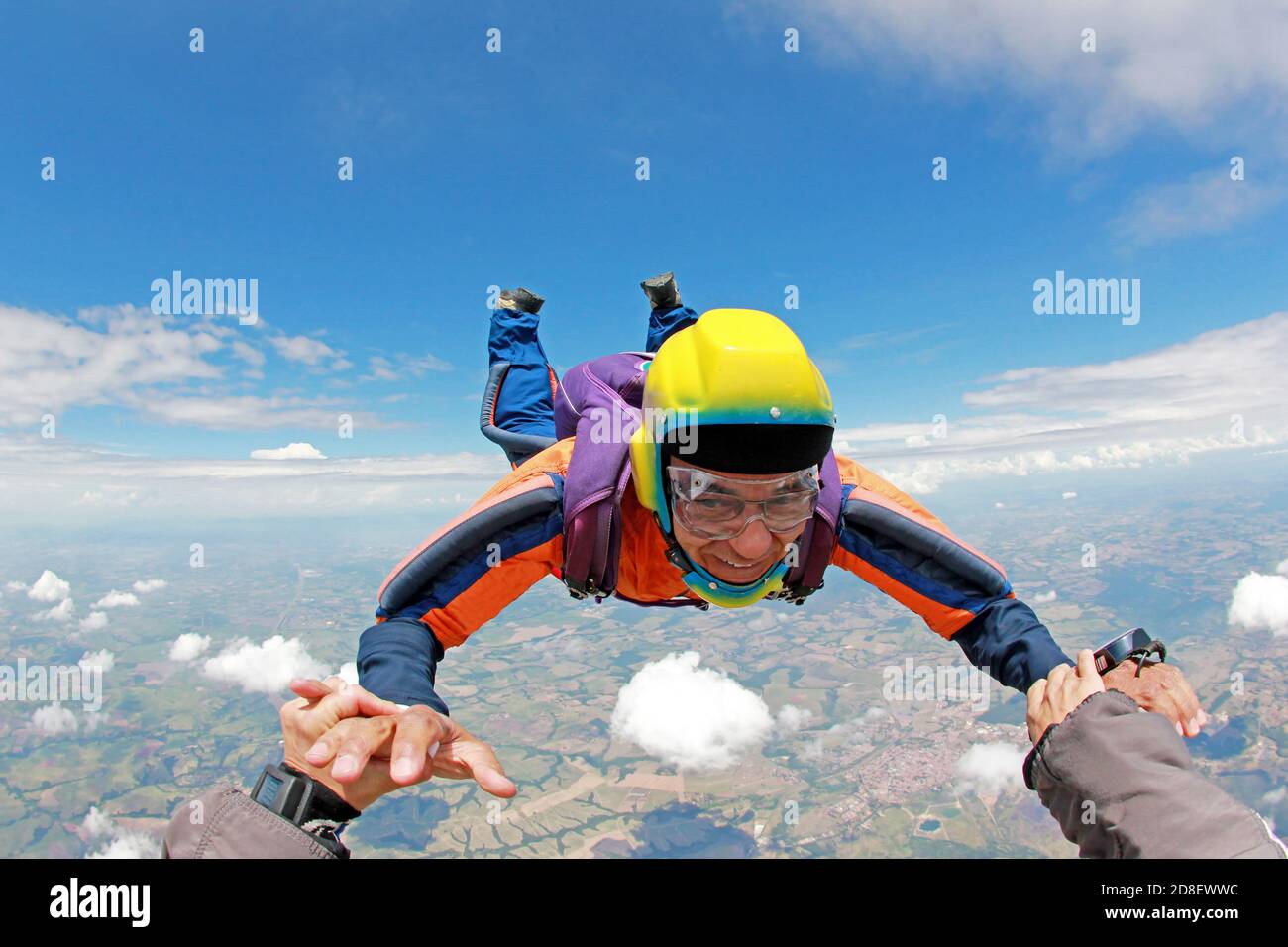 Old man realizing a dream, jumping from a plane Stock Photo