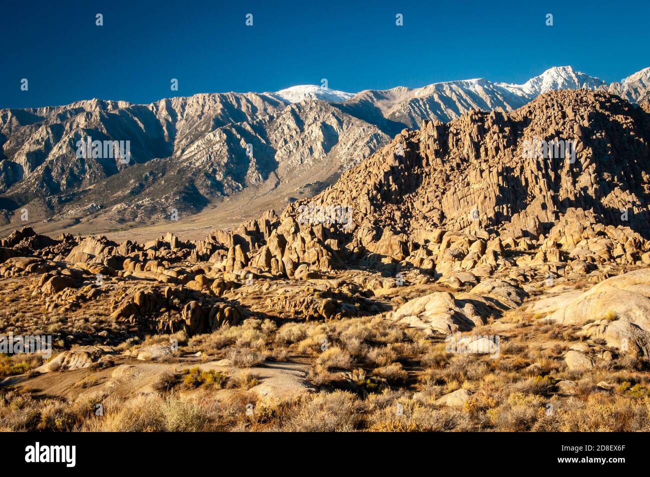 Rugged landscape in the Alabama Hills with the Sierra Nevada Mountains in the background. Stock Photo
