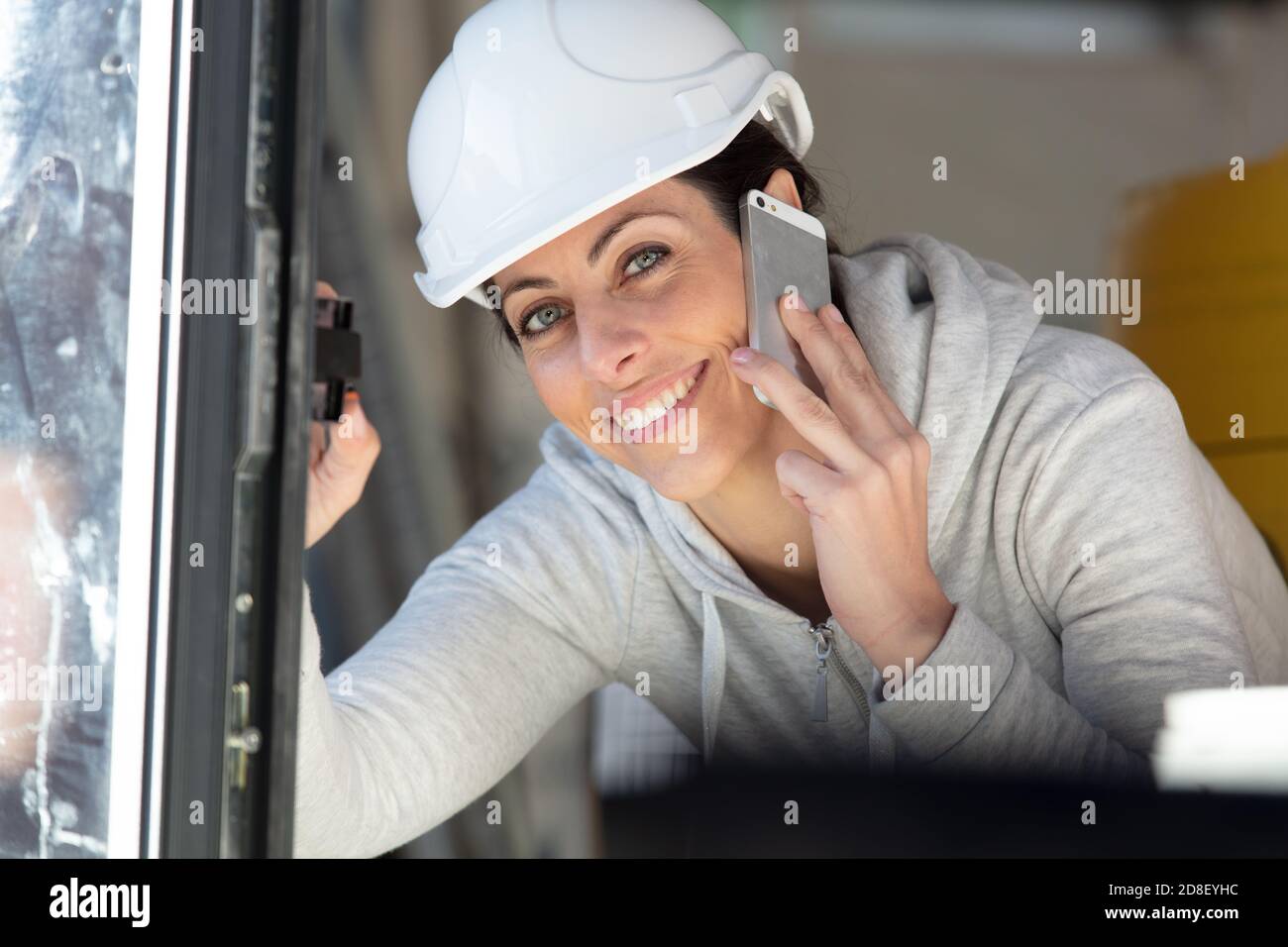 female construction organizer on the phone Stock Photo