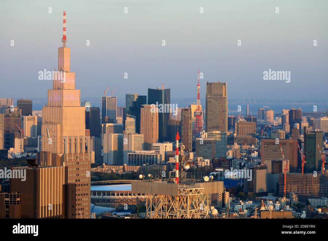 Tokyo cityscape seen from the observation deck of Tokyo Metropolitan Government Building with NTT Docomo Yoyogi Building in foreground.Shinjuku.Tokyo.Japan Stock Photo