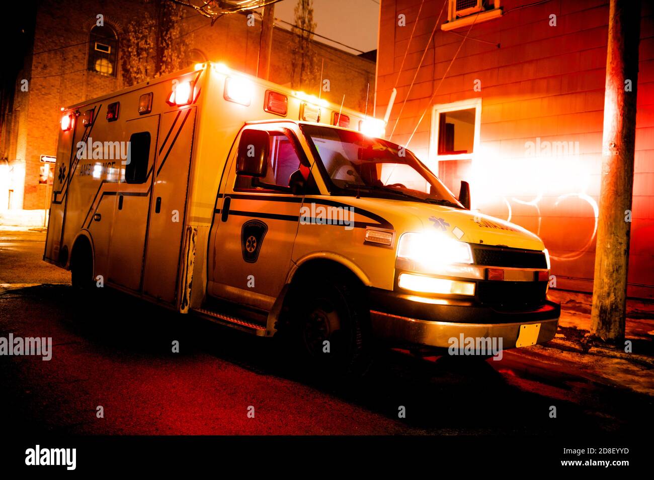An ambulance car parked on the side street at night Stock Photo Alamy
