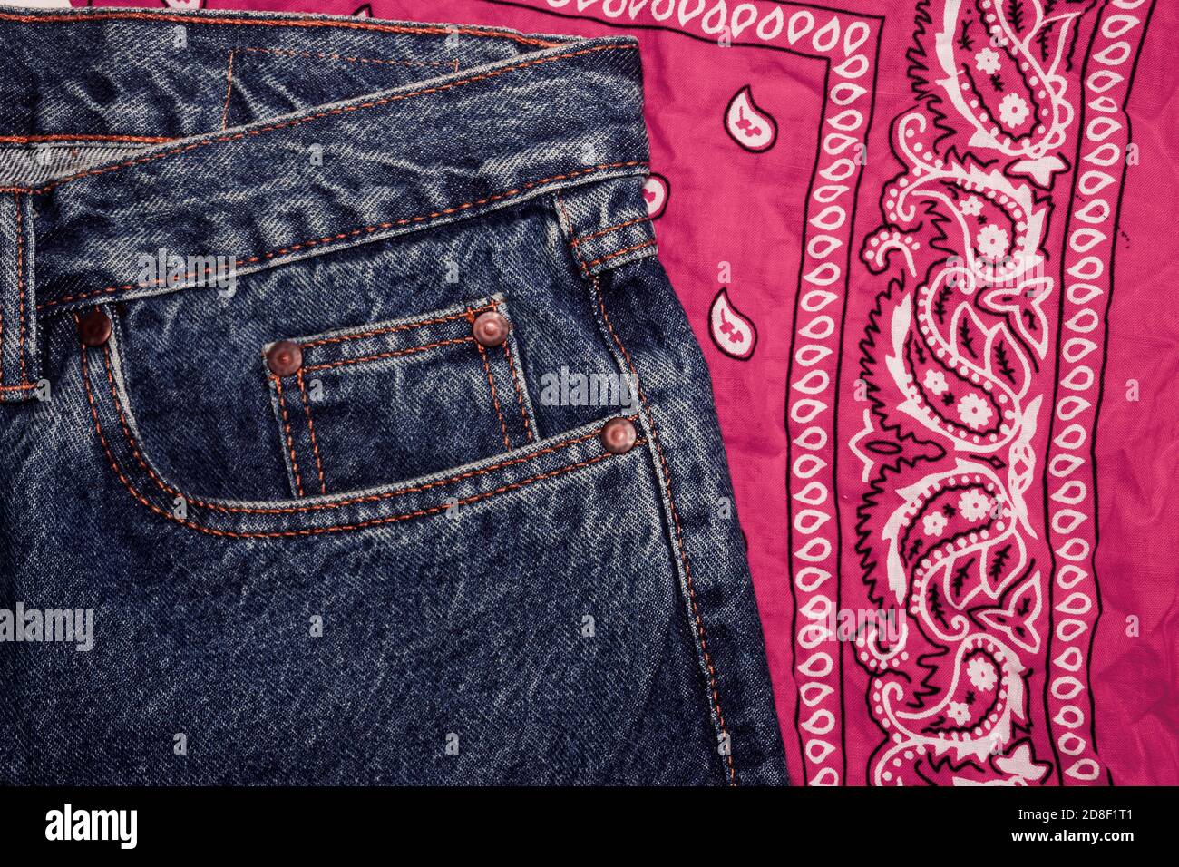 Classic jeans with five pockets close-up. Paisley patterned bandana,  classic red and white neckerchief, biker headscarf. Rough denim.  Fashionable casual style, hippie, western, boho. Clothing for the festival  Stock Photo - Alamy