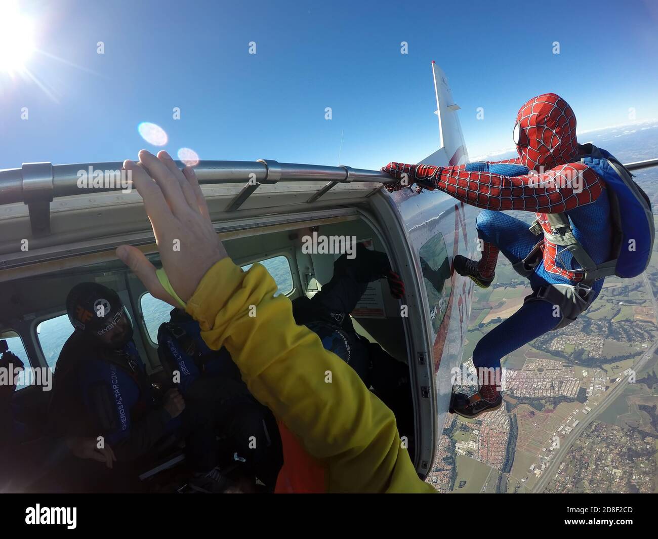 Parachutist cosplay dressed as a spider man Stock Photo