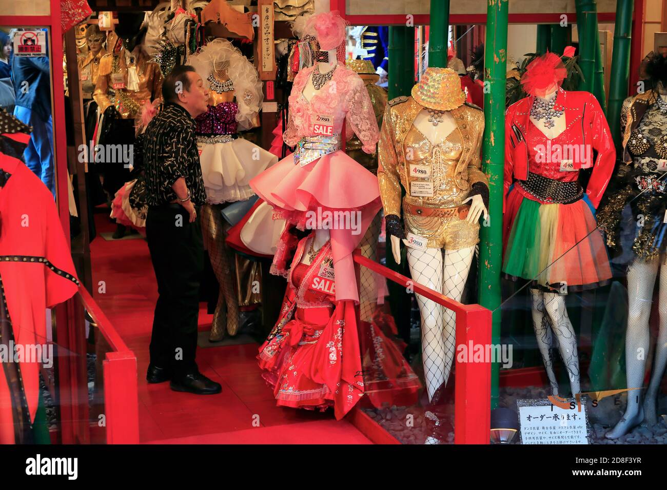 A man checking out the Lolita fashion dresses in a boutique in Takeshita Street.Harajuku.Shibuya.Tokyo.Japan Stock Photo