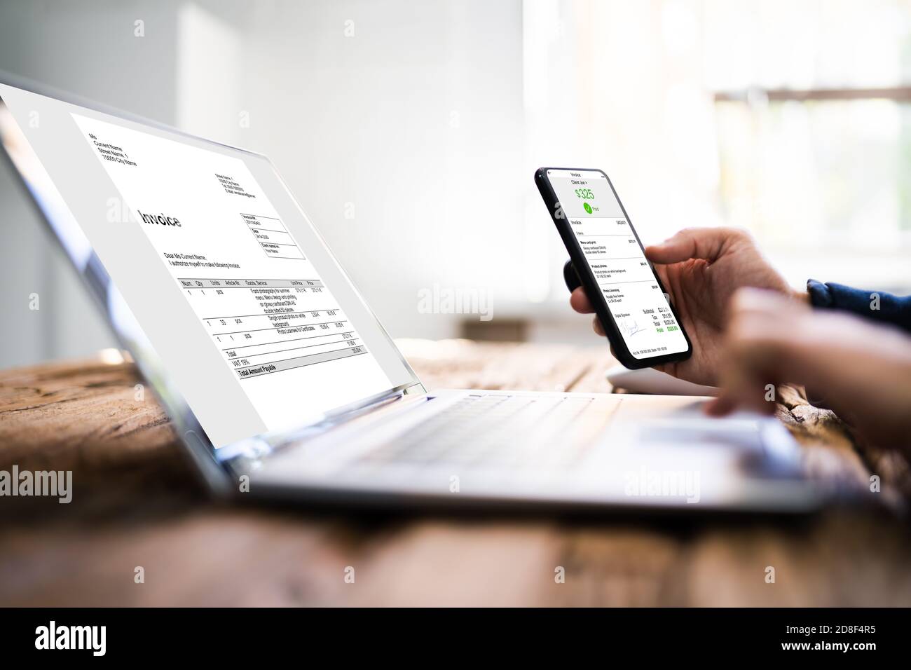 Digital Invoice Document On Tablet Or Laptop. Accountant Tech Stock Photo