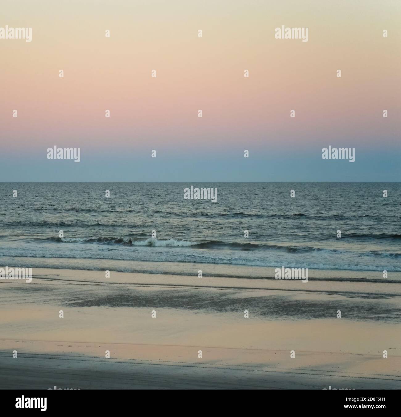 Waves hitting beach sunset shot hi-res stock photography and images - Alamy