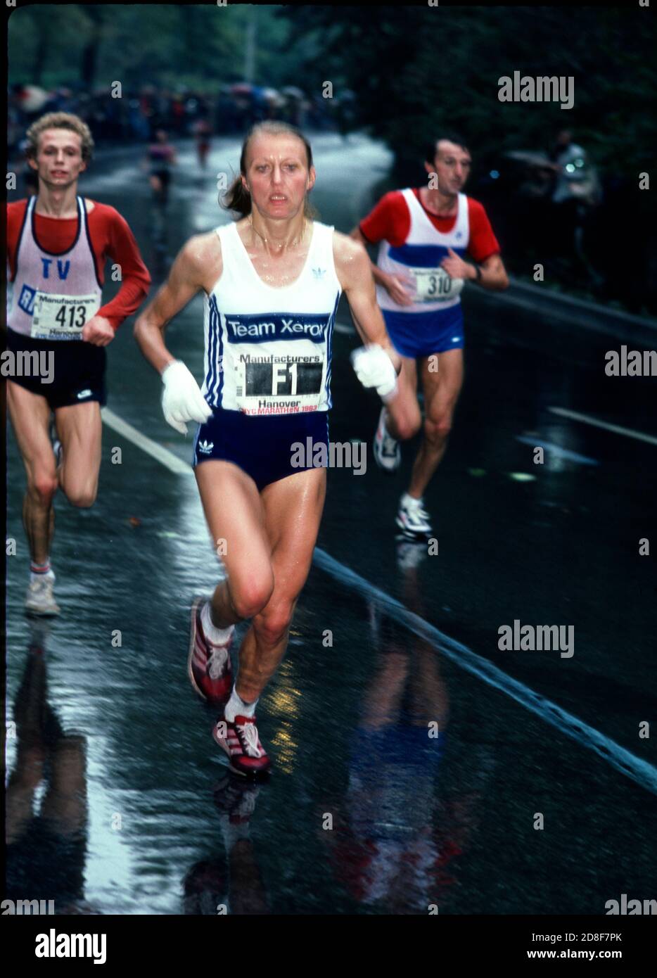 Norwegian marathon runner Grete Waitz running in the rain in Central Park during the 1983 New York City Marathon which she won in New York on October 23, 1983.  Photo by Francis Specker Stock Photo