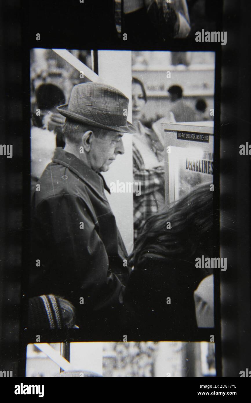 Fine 1970s Vintage Black And White Photography Of A Young Man Smoking A Cigarette And Having A Friendly Conversation Image383980878