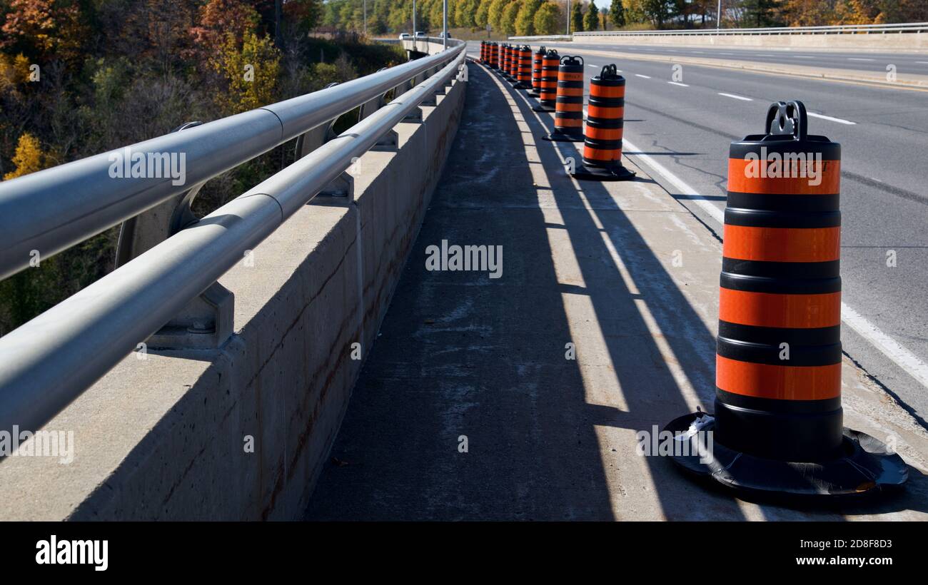 Road construction safety cones on a bridge construction Stock Photo