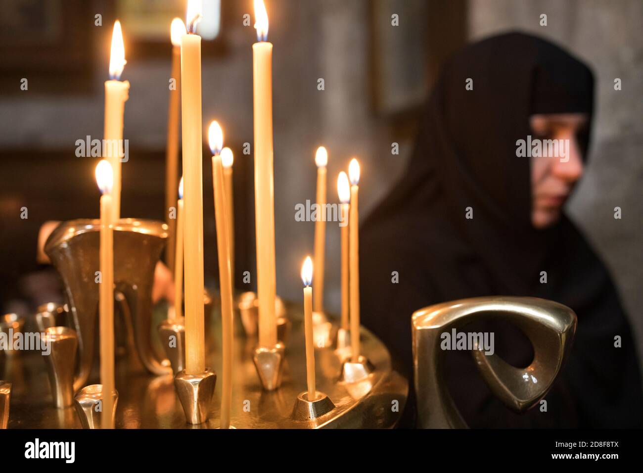 Nun candle hi-res stock photography and images - Alamy