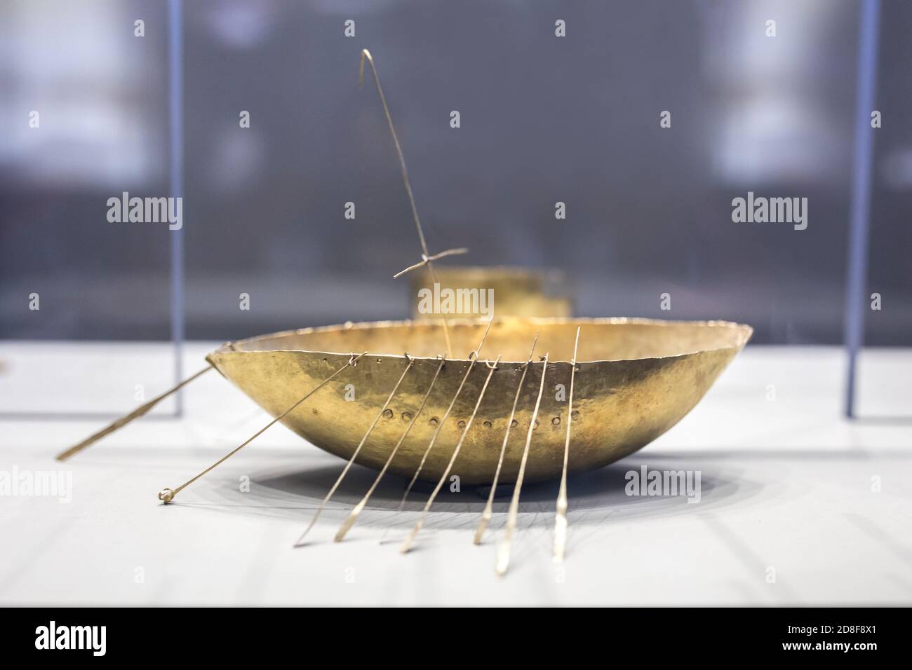 Dublin, Ireland - Feb 20th, 2020: Gold sailing ship. Artefacts that belongs to Iron Age Broighter hoard set. Archaeology National Museum of Ireland Stock Photo