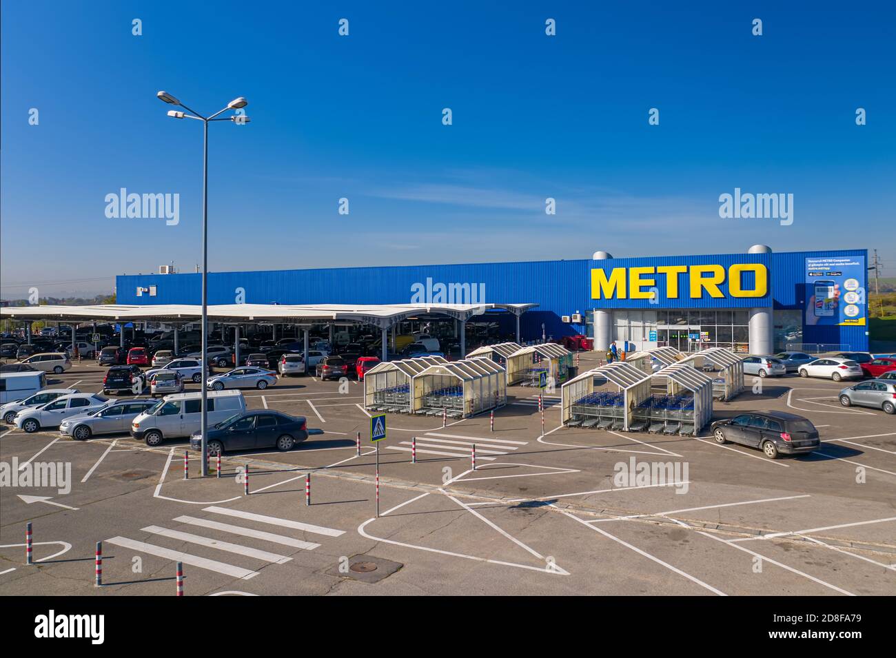 Metro retail store, large shopping mall of household and food goods with parking, aerial view, copyspace Stock Photo