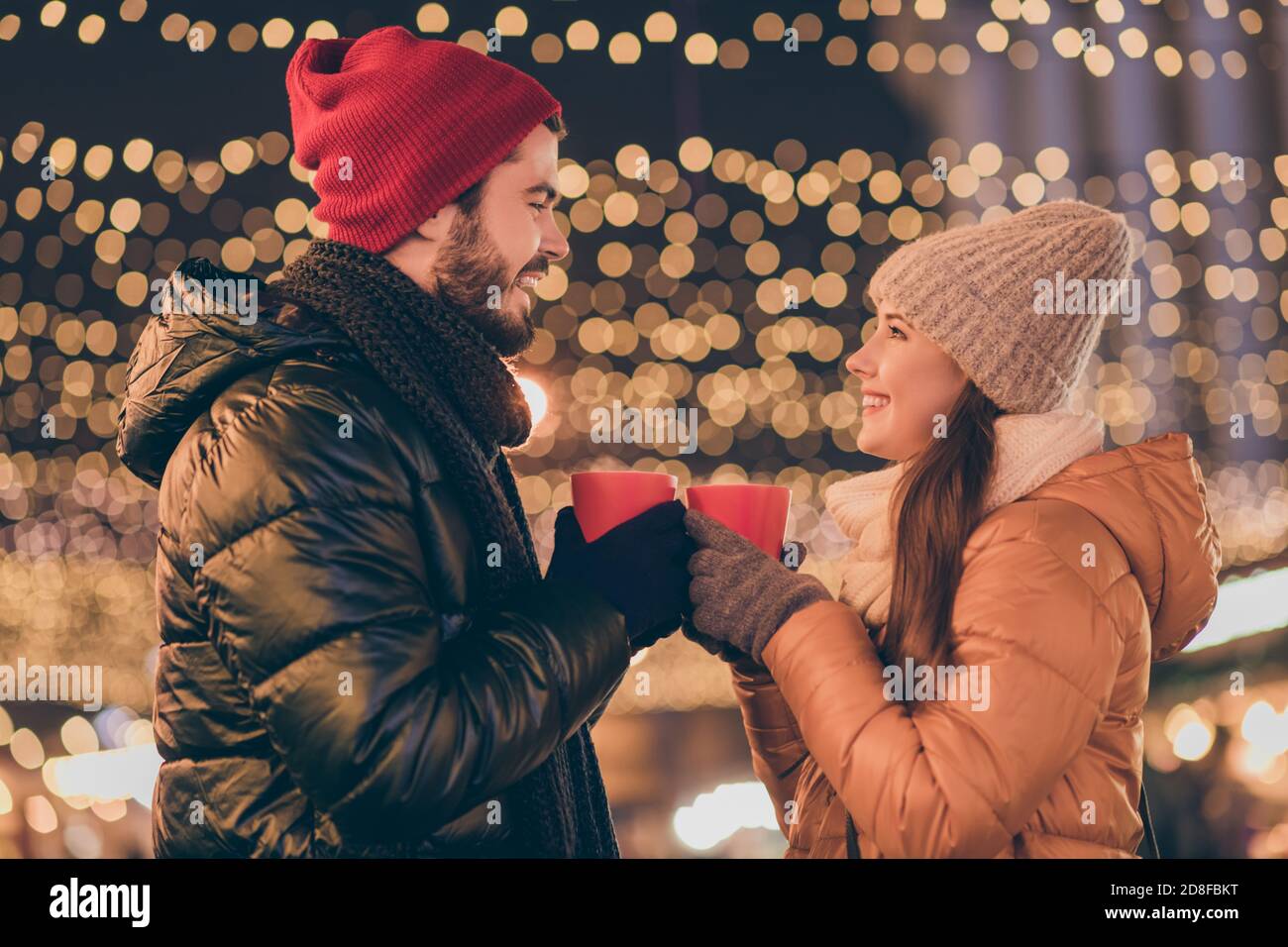 https://c8.alamy.com/comp/2D8FBKT/photo-of-two-people-couple-toast-hot-coffee-beverage-mug-under-outdoors-evening-x-mas-spirit-lights-wear-season-outerwear-2D8FBKT.jpg