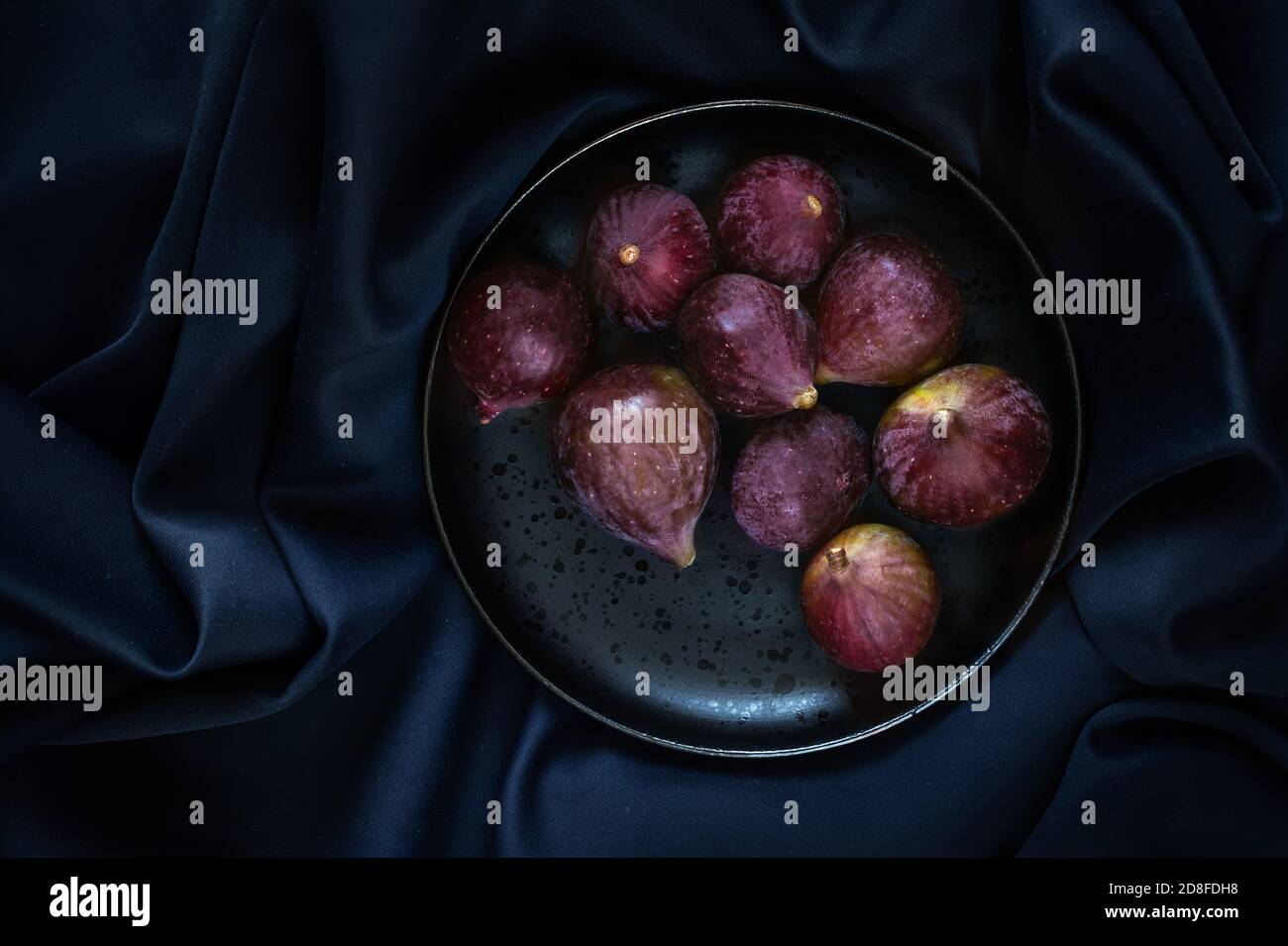 Fresh ripe figs on table black background. Dark Food photo Stock Photo