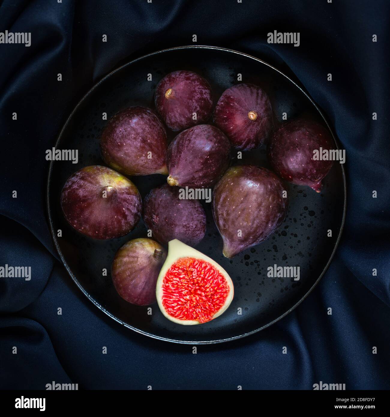 Fresh ripe figs with on table black background. Dark Food photo Stock Photo
