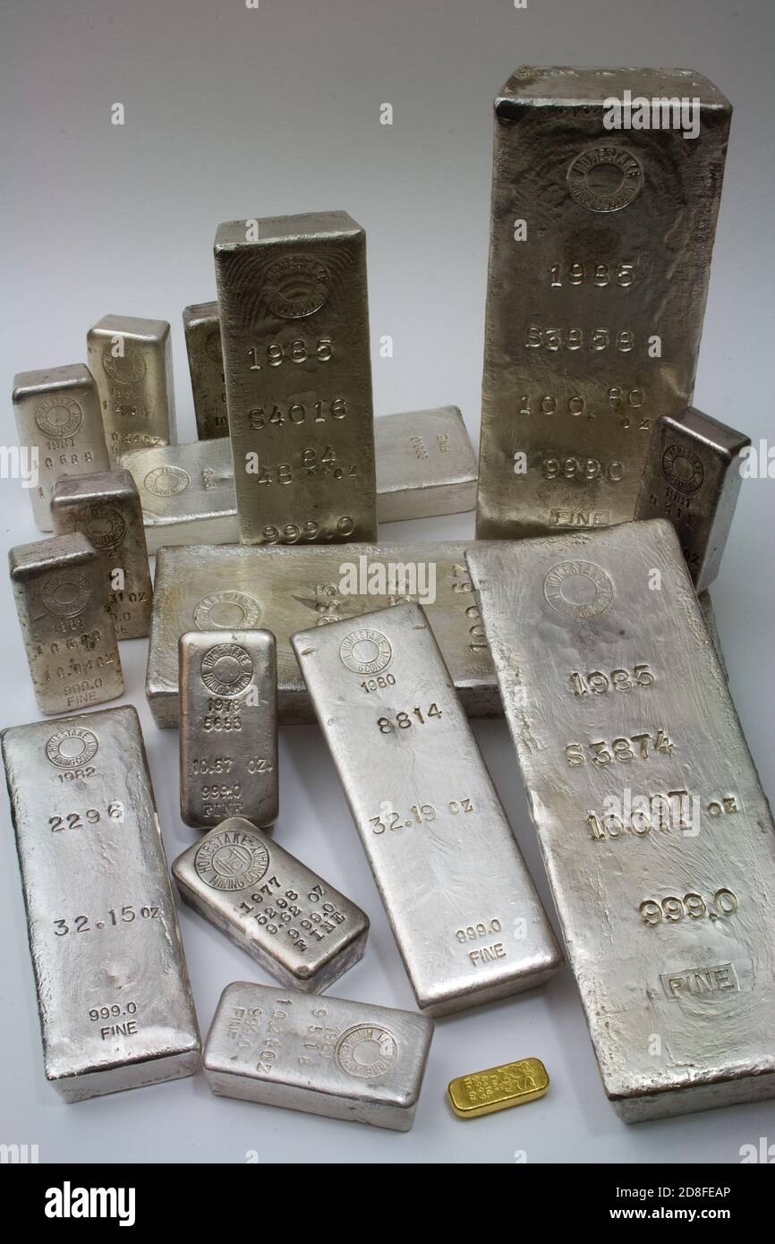 Homestake Mining Company silver bullion bars. Now closed mine located at Lead, South Dakota - Black Hills, USA. One ounce gold bar in foreground. Stock Photo