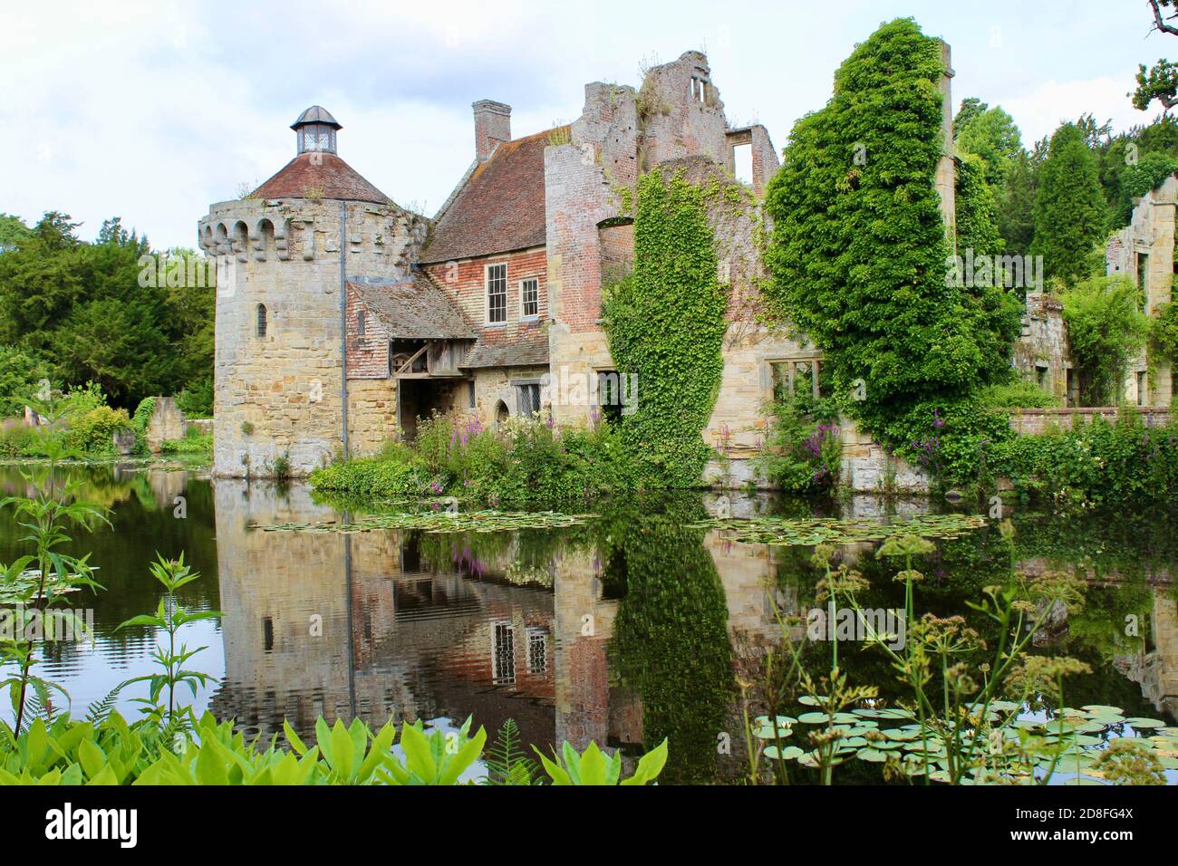 Scotney Castle Lake and Gardens in Summer. This beautiful and historic landscape is located in the valley of the River Bewl near Lamberhurst in Kent. Stock Photo
