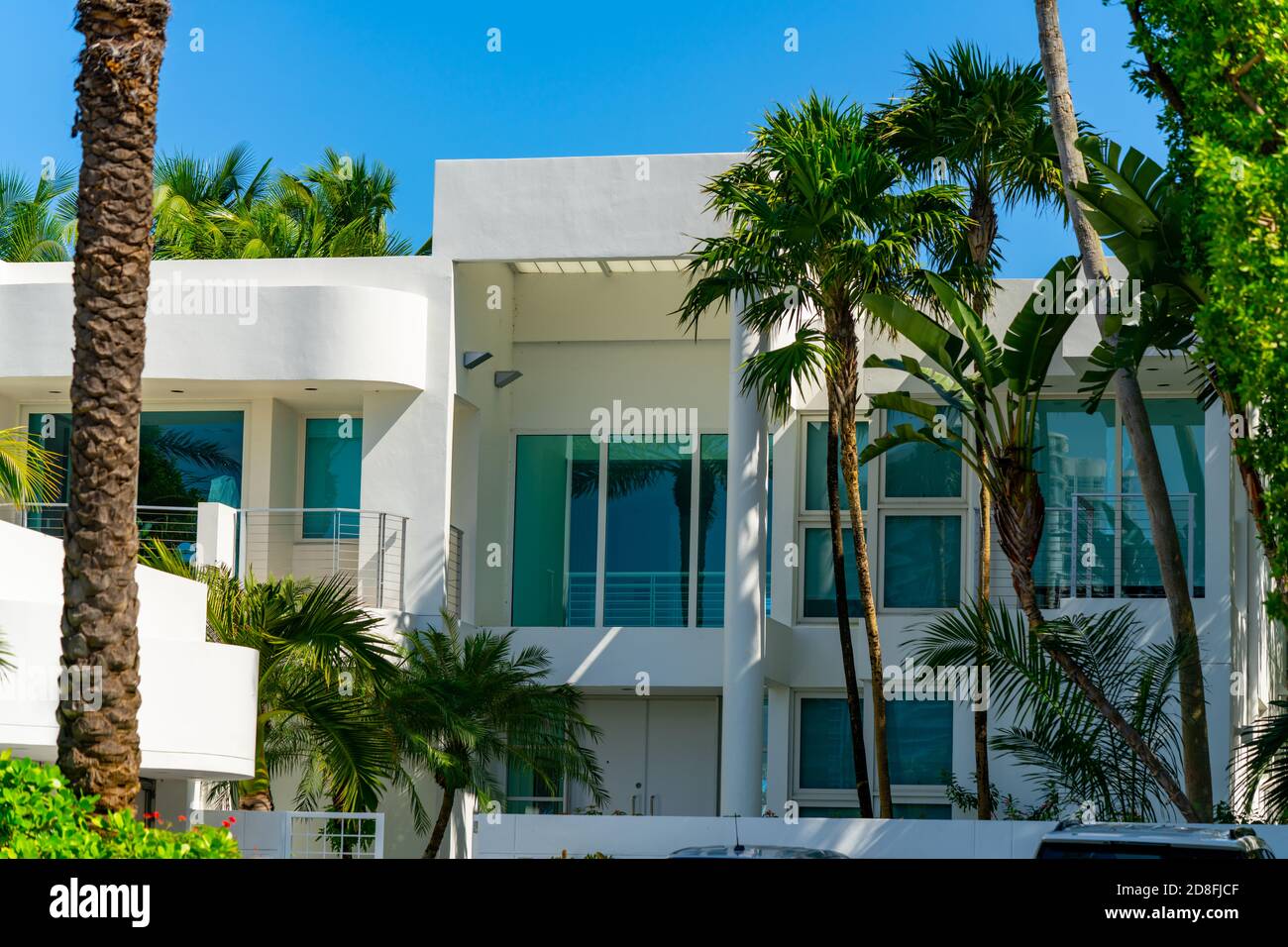 Luxury modern beach home with palm trees Stock Photo - Alamy