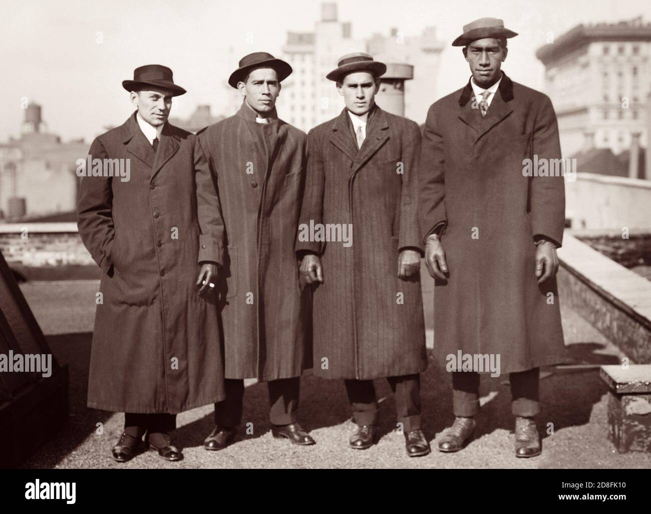 Manager Lew G. Henderson, swimmer Vincent 'Zen' Genoves, E. K. 'Dude' Miller, and Hawaiian swimmer and surfer Duke P. Kahanamoku at the 1912 Olympic Trials in New York. (USA) Stock Photo