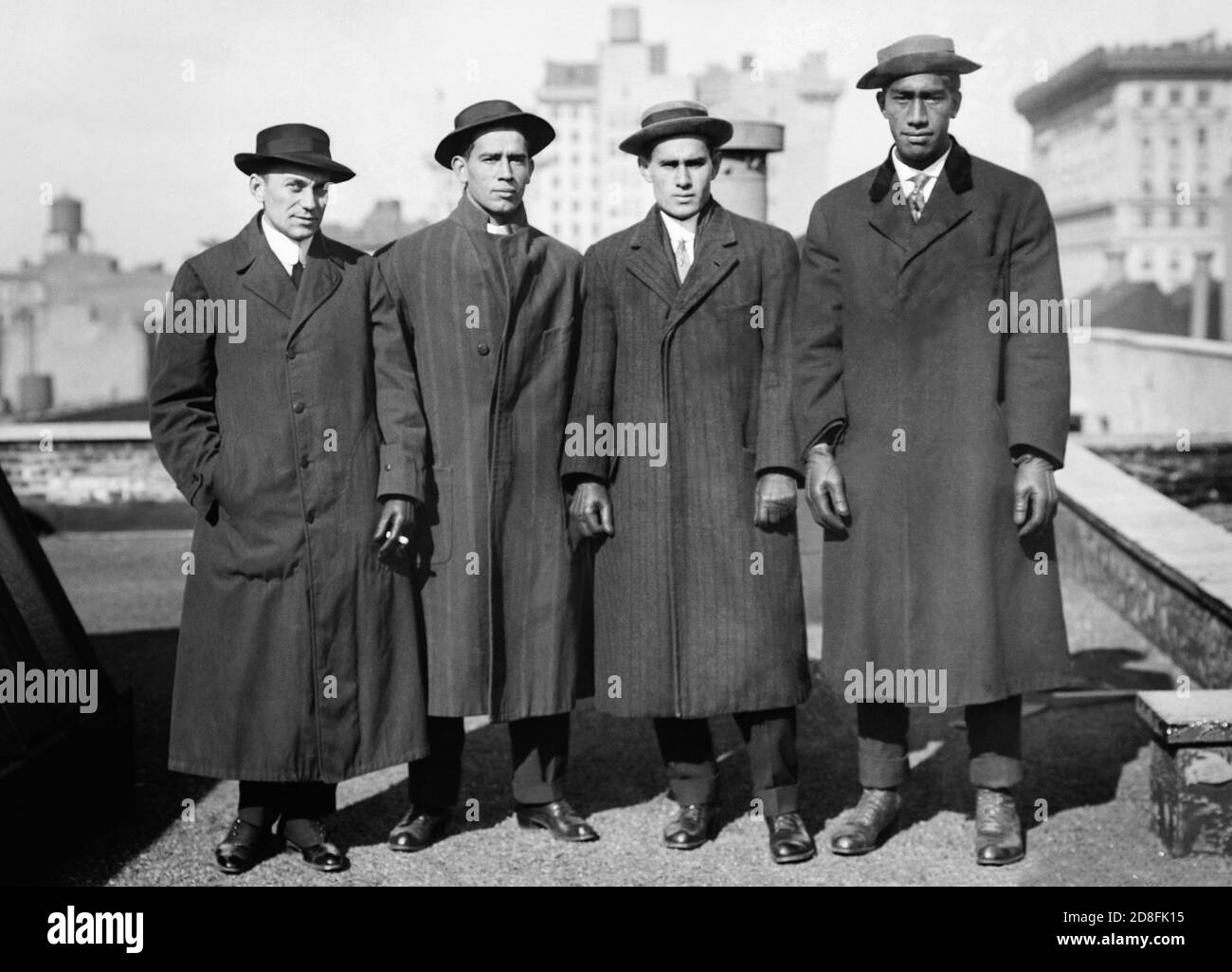 Manager Lew G. Henderson, swimmer Vincent 'Zen' Genoves, E. K. 'Dude' Miller, and Hawaiian swimmer and surfer Duke P. Kahanamoku at the 1912 Olympic Trials in New York. (USA) Stock Photo