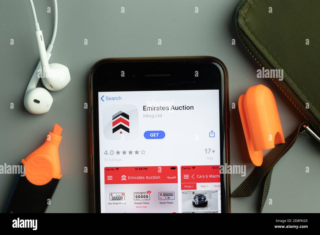 New York, USA - 26 October 2020: Emirates Auction mobile app icon logo on phone screen close-up, Illustrative Editorial Stock Photo