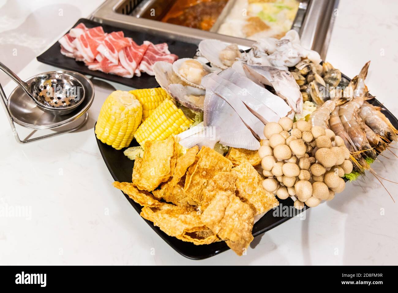 Steamboat hotpot meal with luxurious seafood sliced meat ingredients