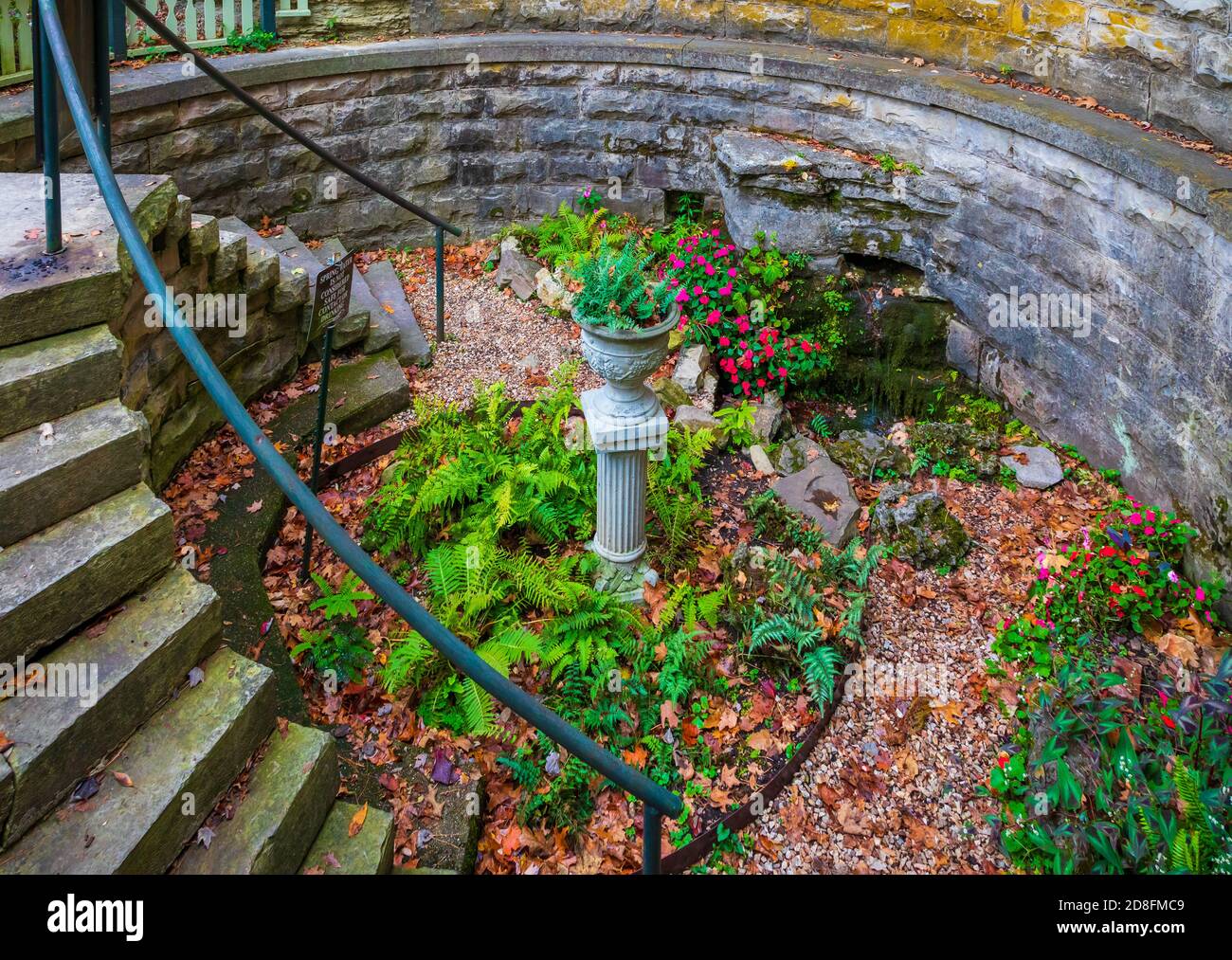 Sweet Spring in Eureka Springs is Sweet Spring Park basin bowl collecting water and the beautiful fl Stock Photo