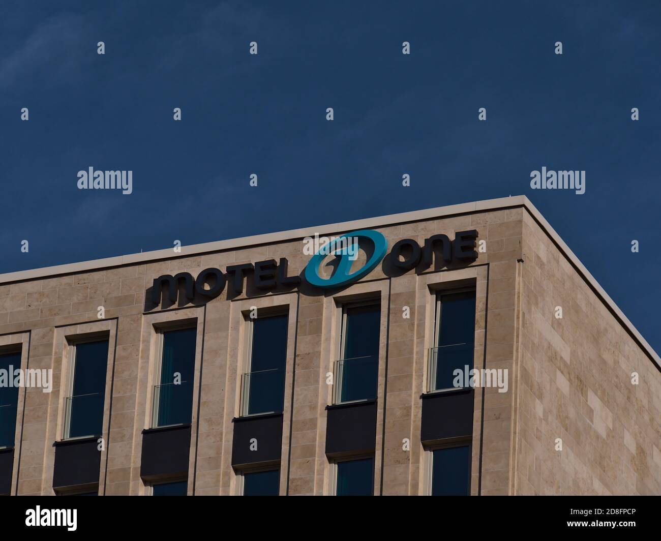 Freiburg, Baden-Wuerttemberg, Germany - 10/25/2020: Logo of budget design hotel chain Motel One (more than 70 hotels) on the top of new building. Stock Photo