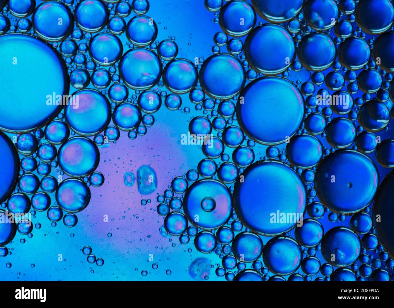 Abstract colorful bubbles. Mixing water and oil. Unrealistic colored blue bubbles. Can be used