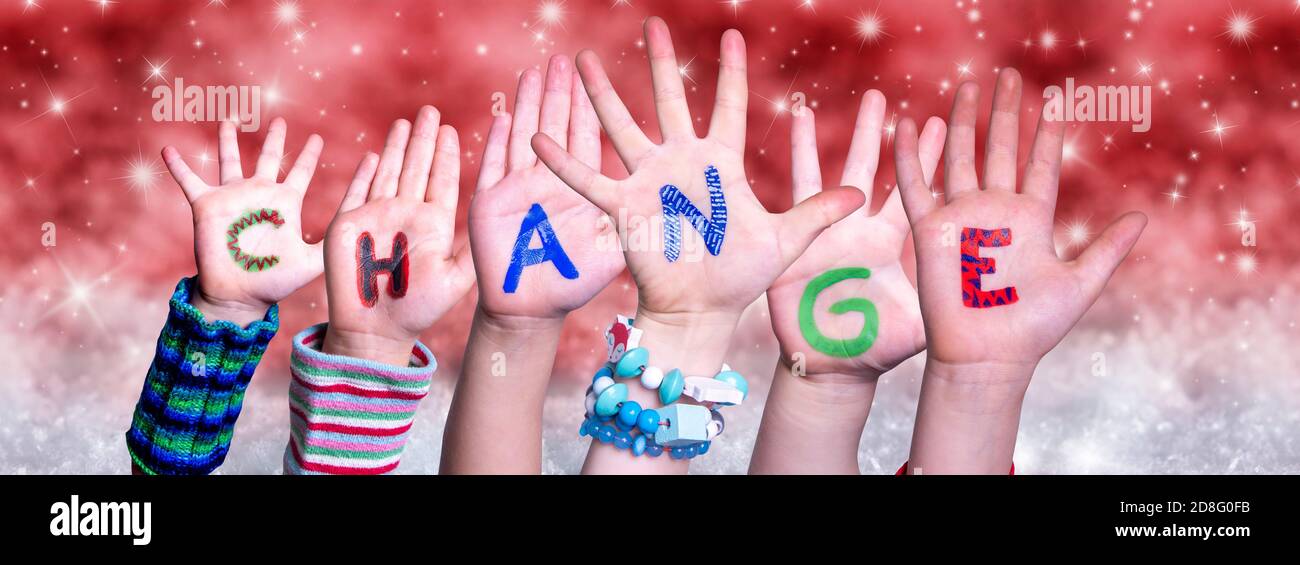 Children Hands Building Word Change, Red Christmas Background Stock Photo