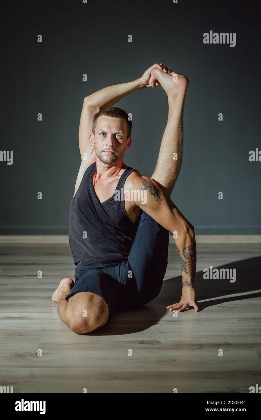 Young Woman Practicing Monkey Pose Yoga Version Front Splits Stock Photo by  ©DragonImages 665250392