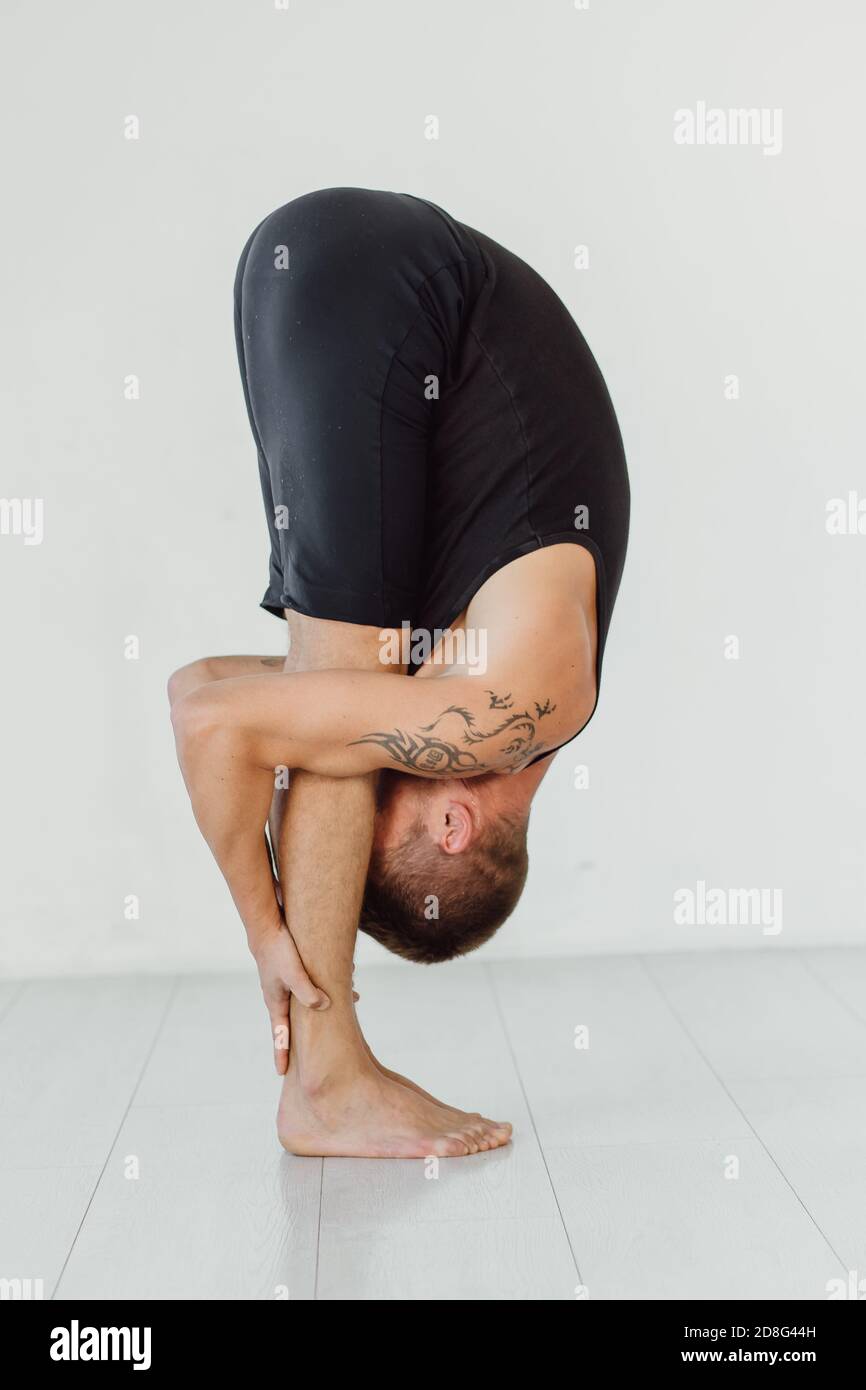 Hands to feet pose. Standing forward fold yoga pose Stock Photo Alamy