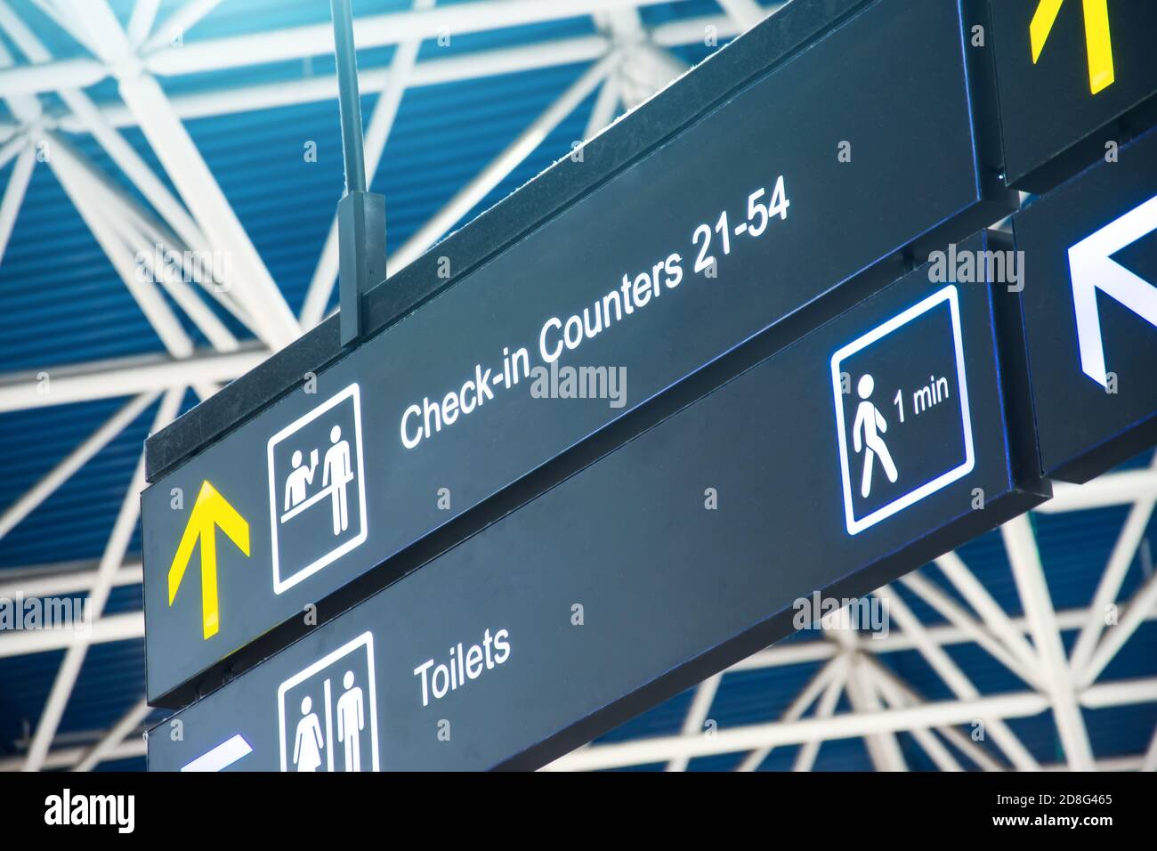 Directions on the sign at the airport Check in Counters and Toilets