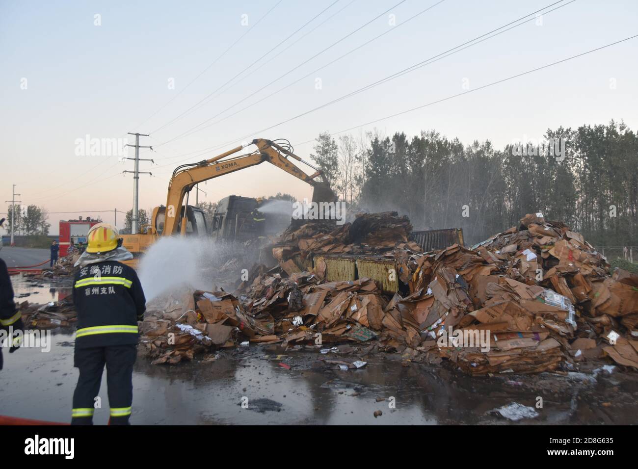 Suzhou, Suzhou, China. 30th Oct, 2020. AnhuiÃ¯Â¼Å'CHINA-Smoke billows and flames billow as a large truck loaded with cardboard boxes bursts into flames in Suzhou, Anhui province, on October 23, 2020. Smoke billowed into the sky after a semi-trailer loaded with old cardboard boxes burst into flames on the road of The Outer ring Road of Longcheng Town in Xiaoxian County, Anhui Province, at 15:30 p.m. After the local fire alarm, quickly rushed to the scene to carry out the fight. Credit: SIPA Asia/ZUMA Wire/Alamy Live News Stock Photo
