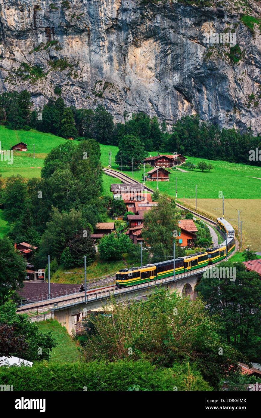 Train going through the Lauterbrunnen valley in Switzerland Stock Photo