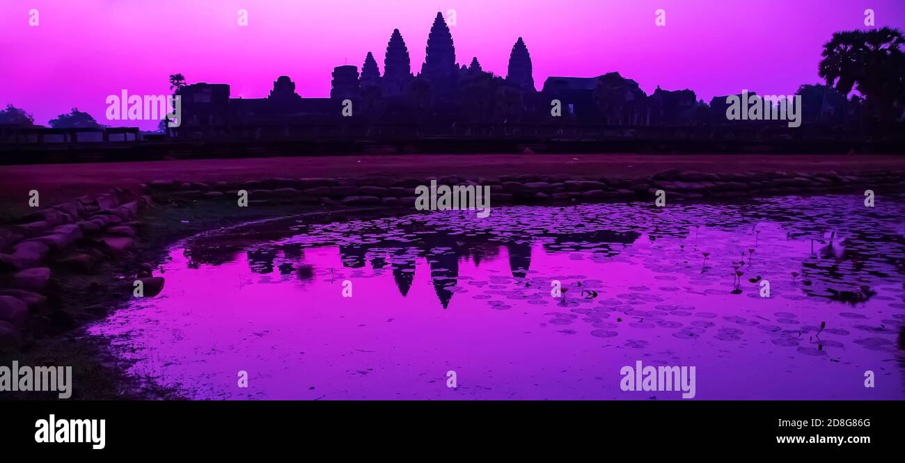Sunrise Purple reflection on water pond bathing pool of Angkor Wat