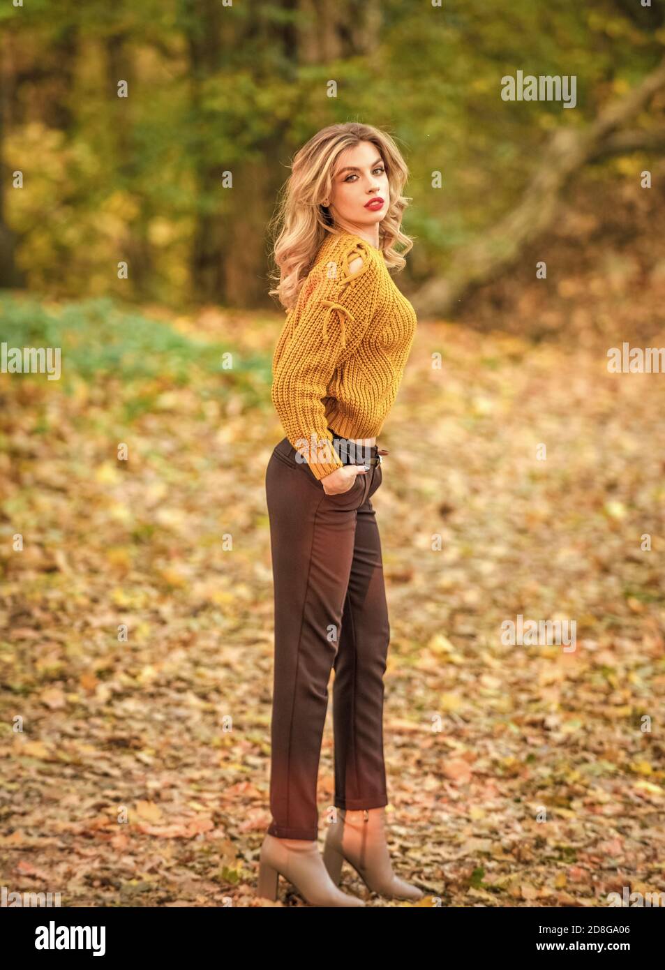 Trendy clothes. Woman wear warm sweater nature background defocused.  Gorgeous lady feeling cozy in woolen sweater. Walk in fall park. Fancy girl  wear knitted sweater. Style is all about balance Stock Photo -