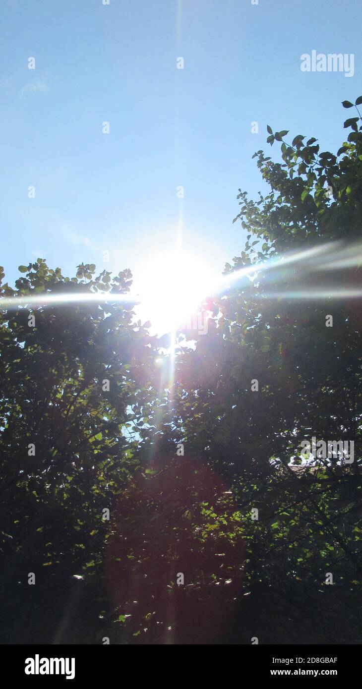 A sky panorama with the sun, blue sky and clouds Stock Photo - Alamy