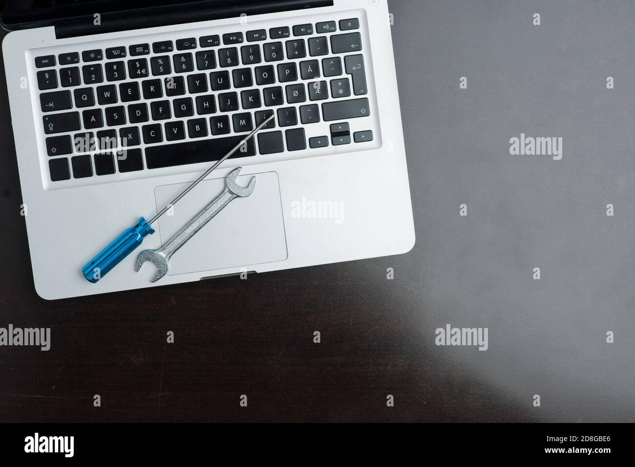 wrench and screwdriver, on blue background.Technical support concept Stock Photo