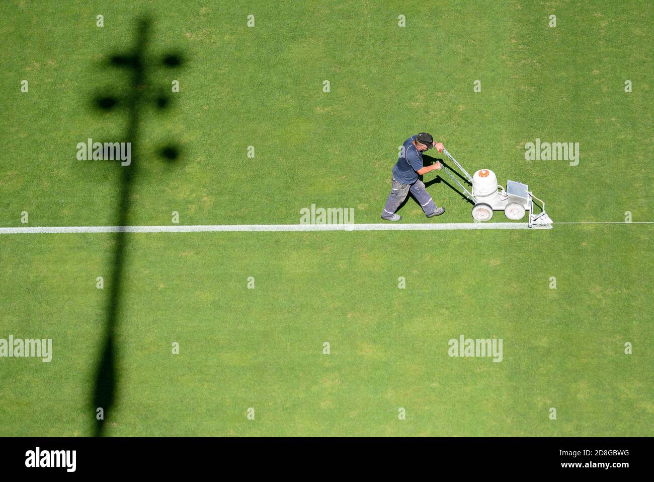 Painting line on a soccer pitch Stock Photo Alamy