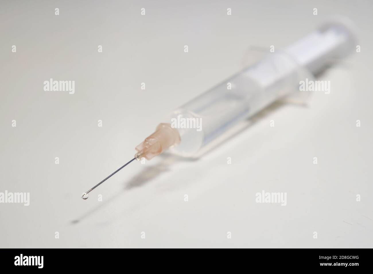 injection with corona, COVID-19 vaccine, extreme close up, free copy space, symbol picture Stock Photo