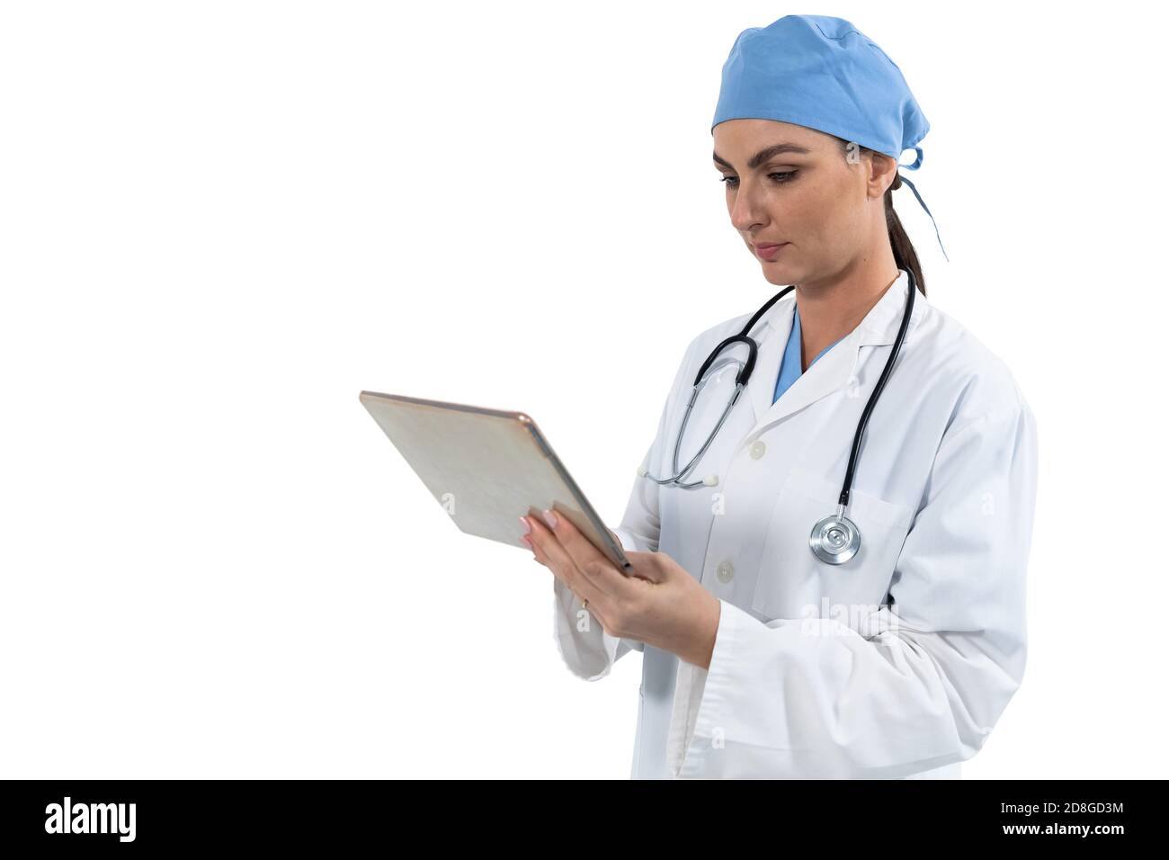 Female doctor using digital tablet against white background Stock Photo