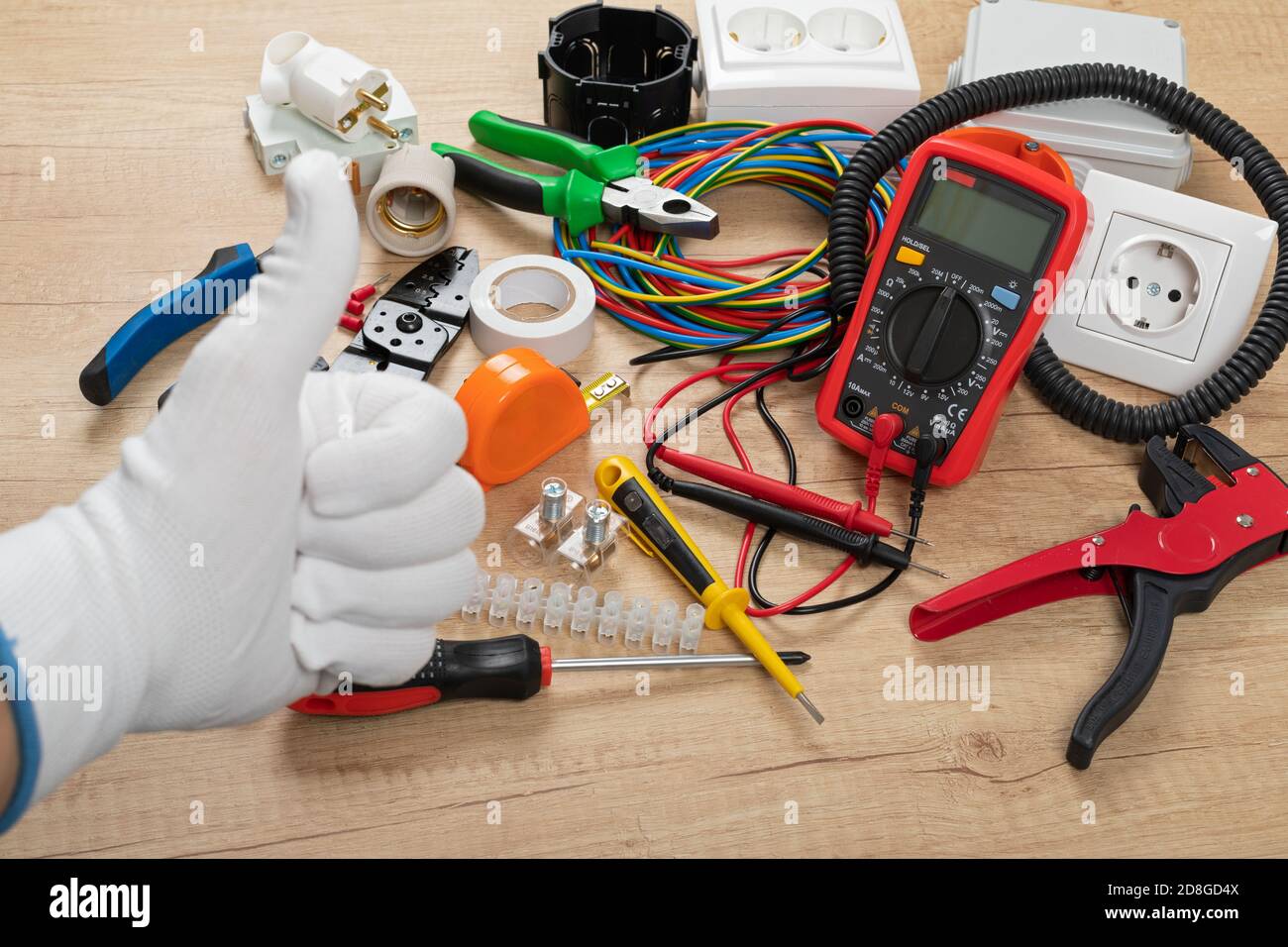 Tools for electrician needs: shocket multimeter, voltage testers, wire strippers, pliers, Stock Photo