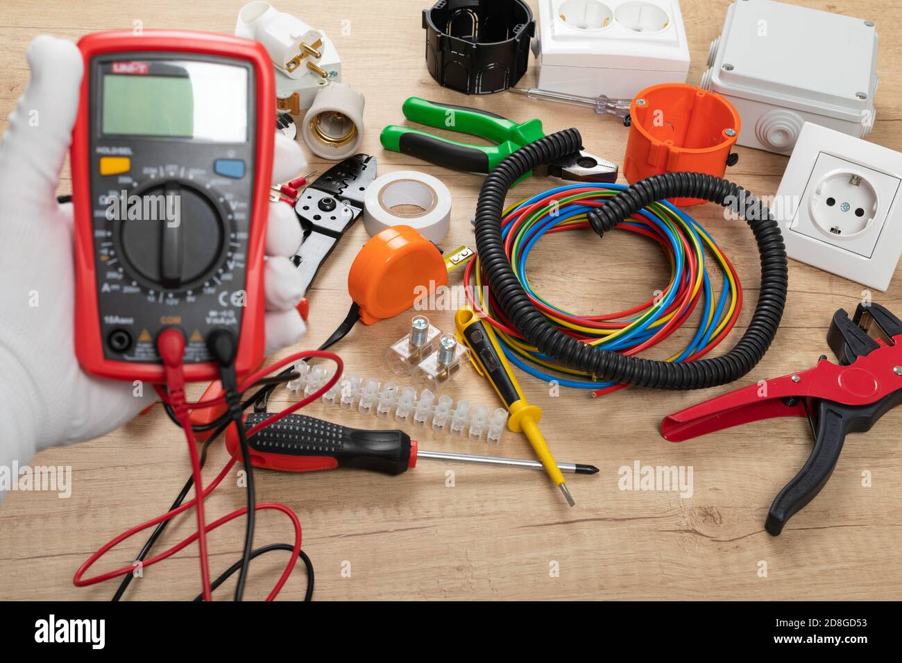 Tools for electrician needs: shocket multimeter, voltage testers, wire strippers, pliers, Stock Photo