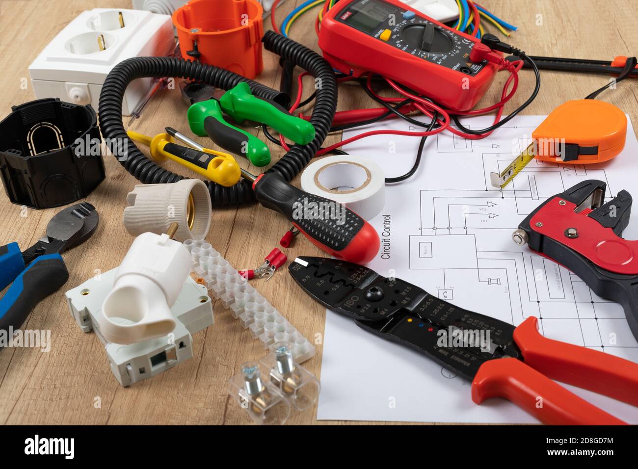 Tools for electrician needs: shocket multimeter, voltage testers, wire strippers, pliers, Stock Photo