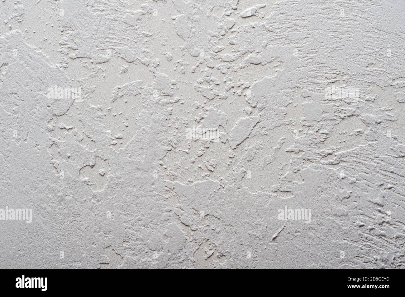 Plaster graphic stains, uneven ancient stone for paint application, background Stock Photo
