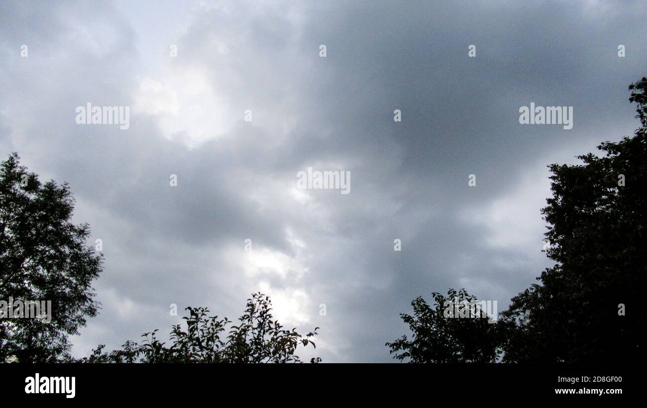 Dark sky with black clouds brings storm rain Stock Photo - Alamy