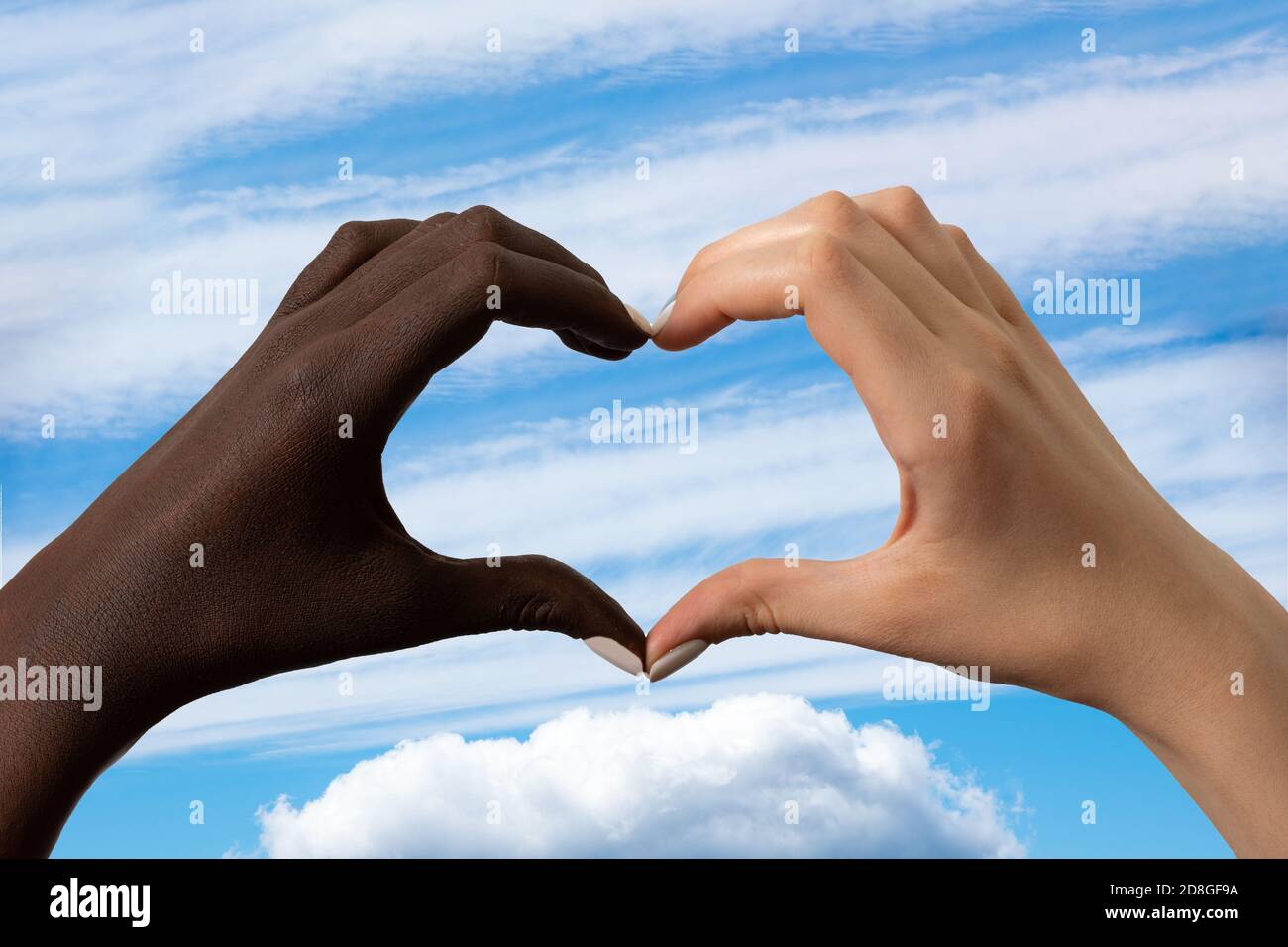 Black and white hands in the form of heart isolated on white background. Interracial friendship stop racism concept Stock Photo
