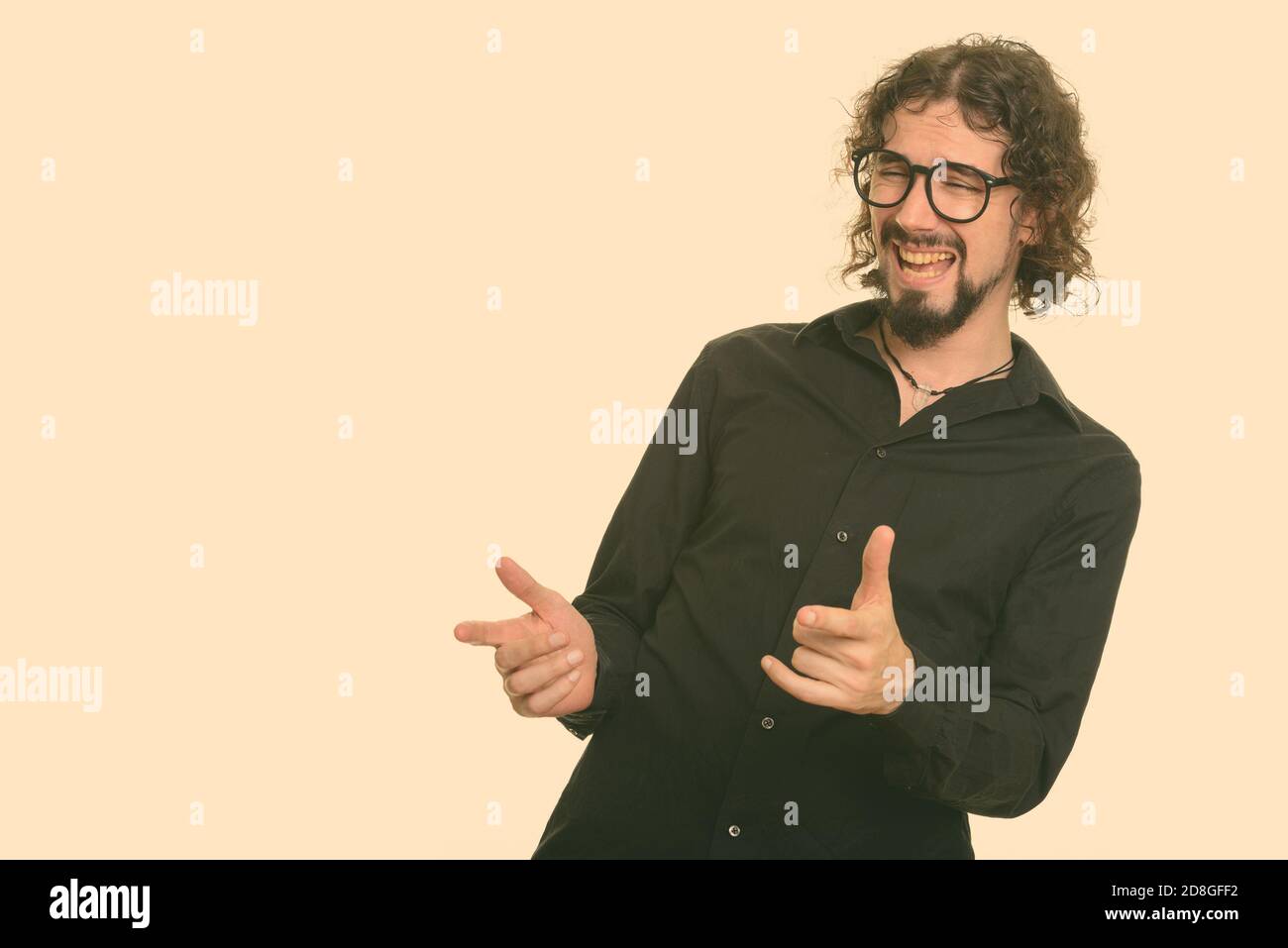 Happy Caucasian man laughing and pointing both fingers Stock Photo