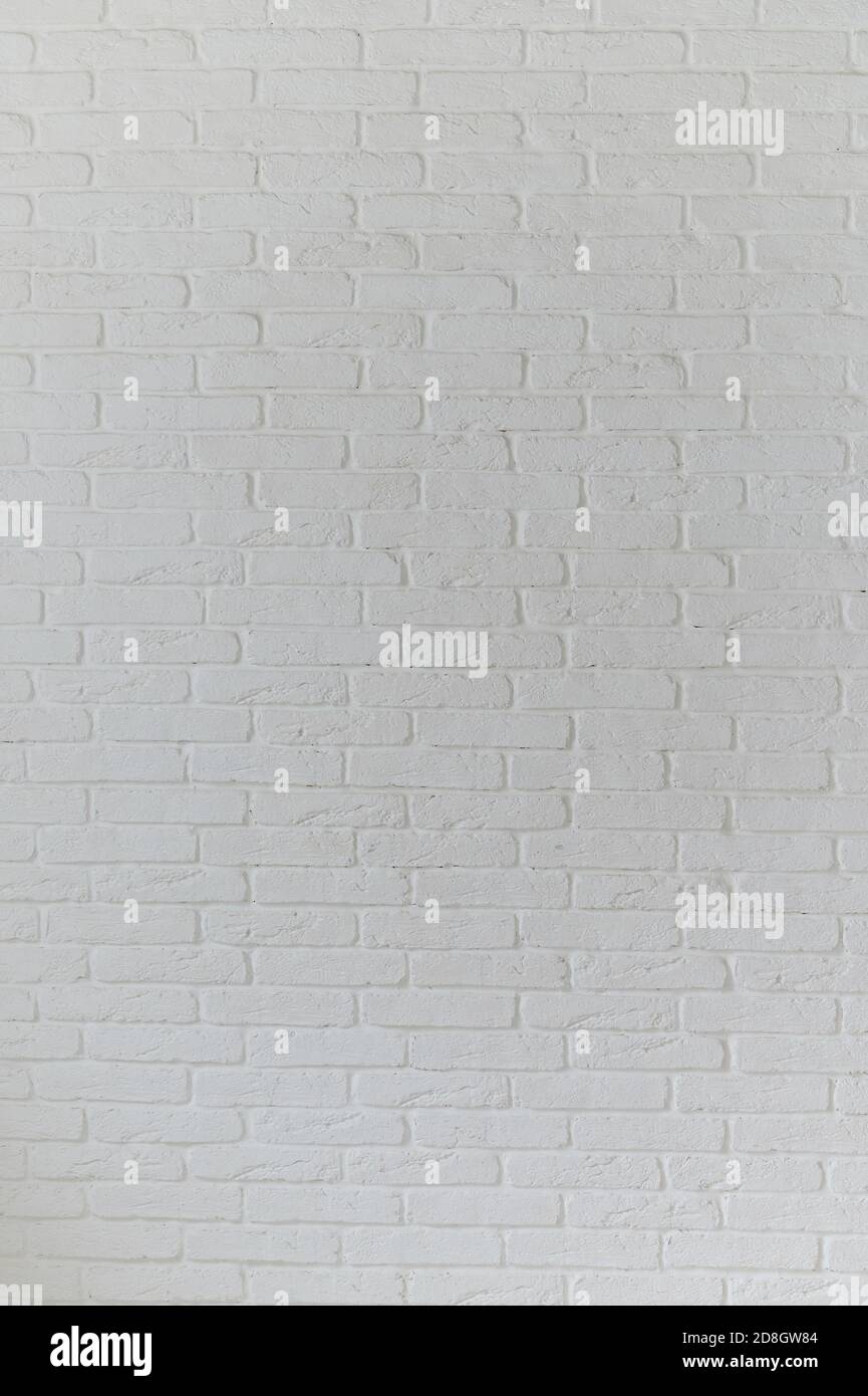 Big vertical white brick wall texture pattern background Stock Photo
